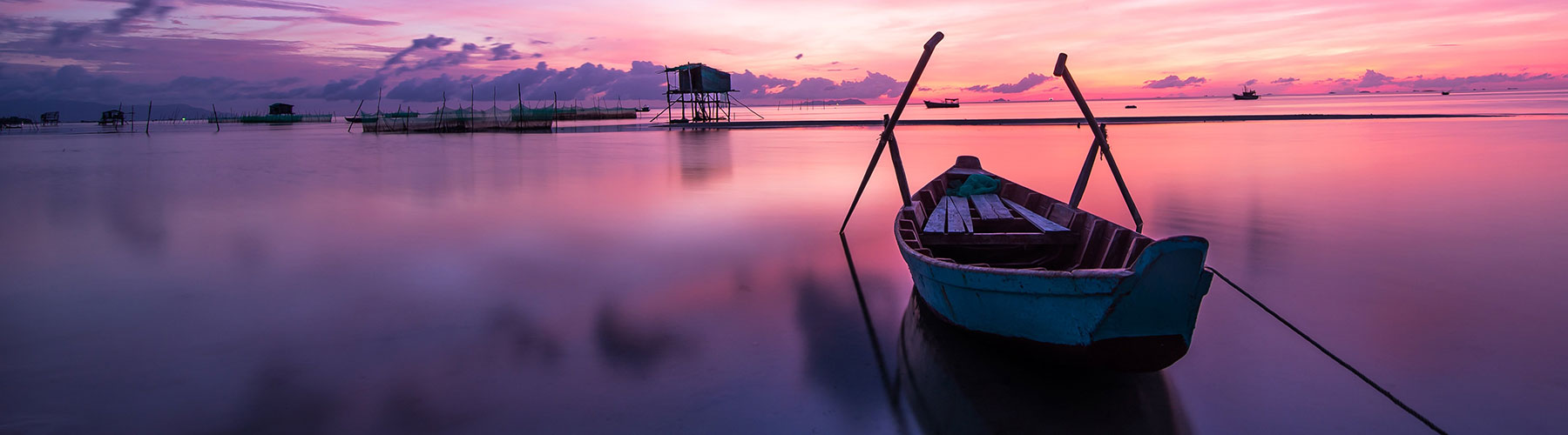 boat on lake at sunset