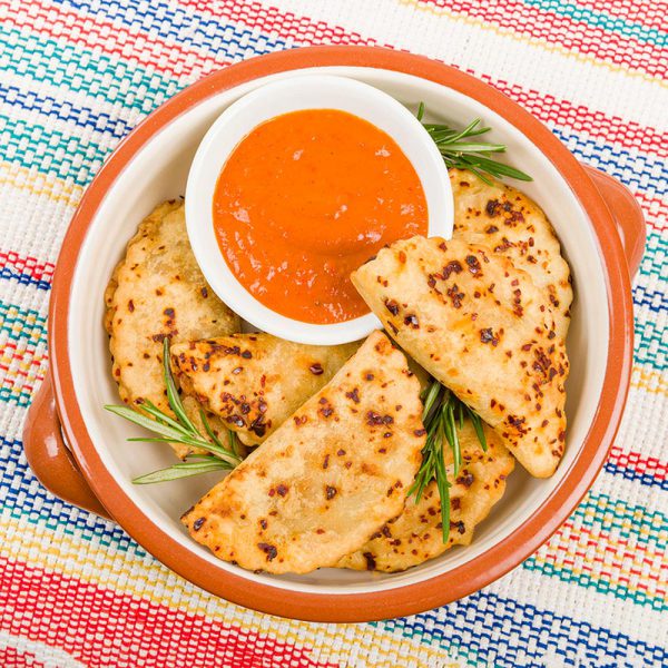 Pierogi baked dumplings with chilli sauce