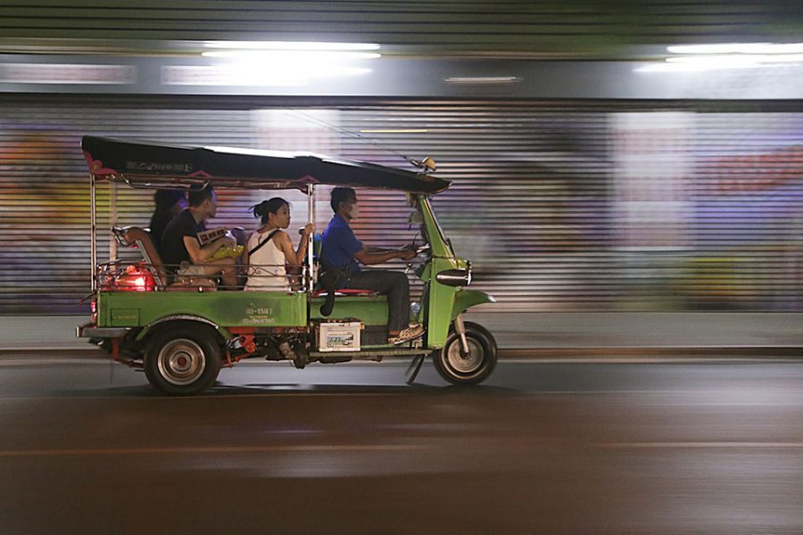 tuk tuk on road with blurry background